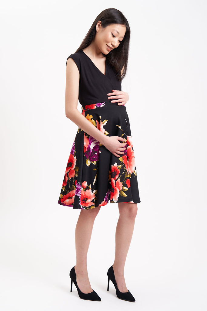 Maternity Dress with Black top and large flowered pattern on skirt.