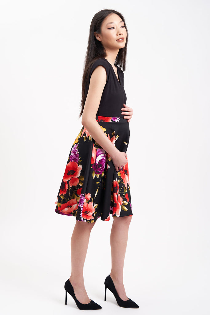 Maternity Dress with Black top and large flowered pattern on skirt.