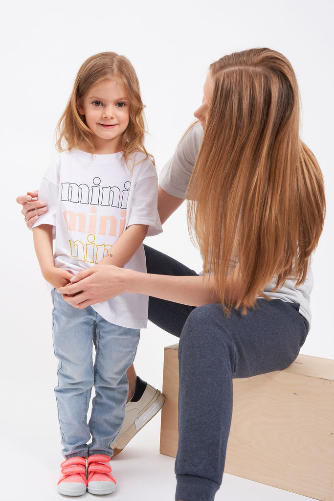 Graphic children’s  t-shirt with lettering of “Mini, mini, mini”.