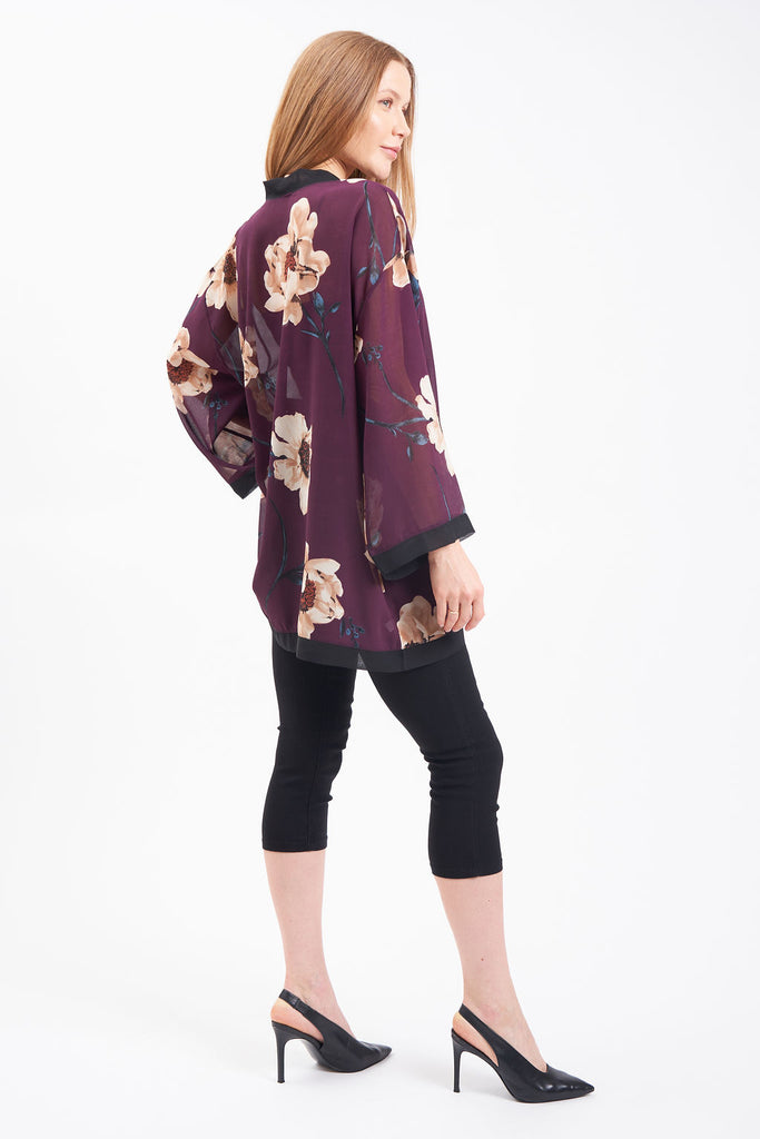 Kimono-style cover up with bell sleeves and floral blossom design.