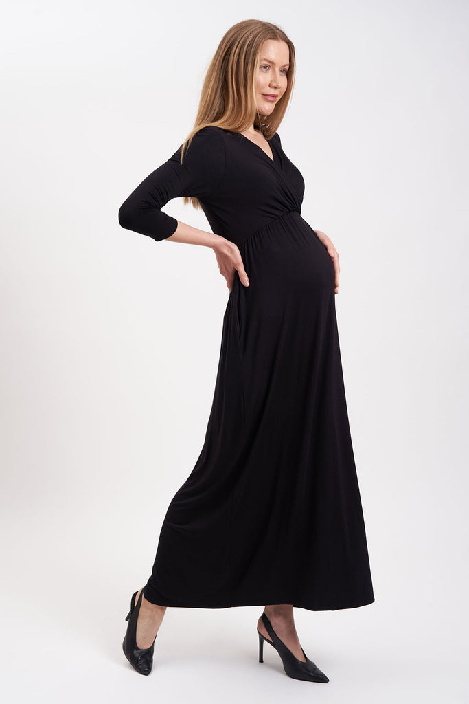 Solid color maxi maternity dress with v-neck and ¾ sleeves.