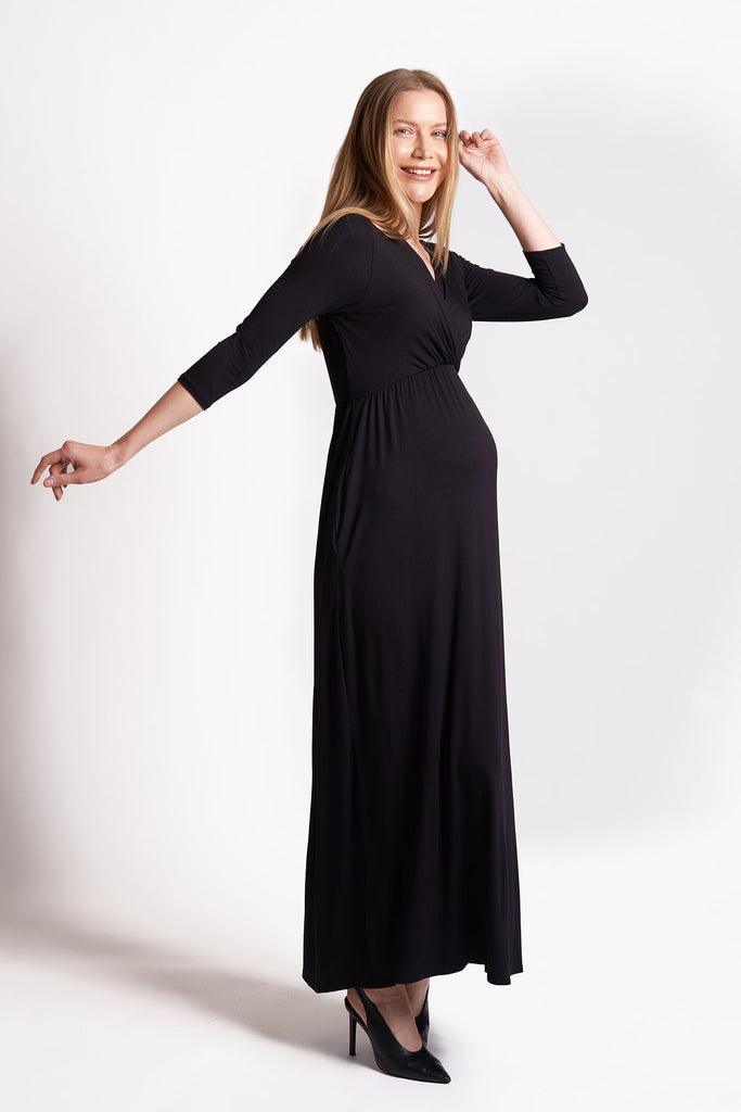 Solid color maxi maternity dress with v-neck and ¾ sleeves.