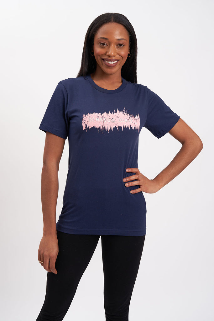 Graphic women’s t-shirt with printed “Blessed Mama” lettering with pink coloring surrounding the text